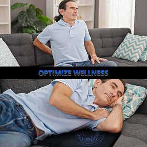 Man using a UTK Technology heating pad while lying on a sofa