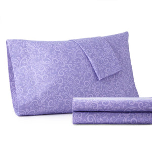 Purple pillowcase and folded sheet set with a tone on tone floral damask pattern