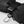 Hestra black glove with velcro wrist strap and metal carabiner attachment
