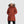 Outdoor Research women's rust colored puffer parka with faux fur hood and white beanie