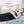 Venture Heat heating pad shown in use over and under the body with diagrams illustrating heat distribution