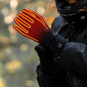 Venture Heat motorcycle glove with glowing orange heating elements visible on the back of the hand