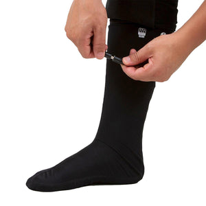 Person connecting power cable to Venture Heat heated base layer sock