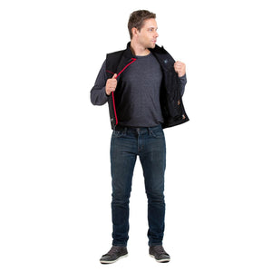 Man wearing a Venture Heat black heated vest over a grey long sleeve shirt and blue jeans