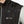 Water beading on a black Venture Heat vest