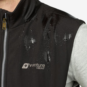 Water beading on a black Venture Heat vest