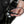 Hand connecting a Venture heated gear power cable to a motorcycle battery harness