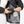 Person connecting battery pack to Venture Heat jacket interior pocket