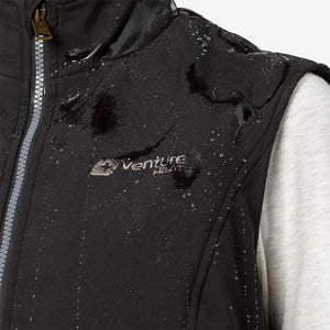 Water droplets on black Venture Heat vest fabric