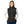 Woman wearing a black Venture Heat softshell vest with a front zipper and power button