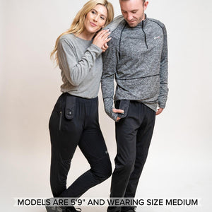 Man and woman wearing Venture Heat black heated pants with visible battery pockets