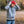 Person wearing a grey Venture Heat zip up hoodie and red beanie in a wooded area