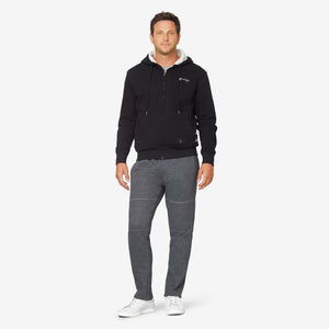 Man wearing a black Venture Heat zip up hoodie and grey sweatpants