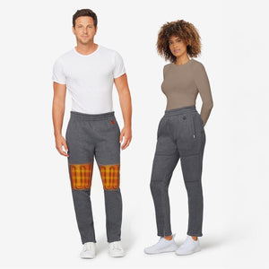 Man and woman wearing Venture Heat grey heated sweatpants with visible heating elements on the thighs
