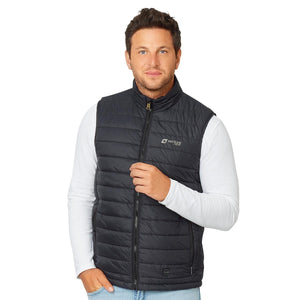 Man wearing a black Venture Heat quilted vest over a white long sleeve shirt