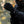 Person wearing black Venture Heat motorcycle gloves with power button on wrist