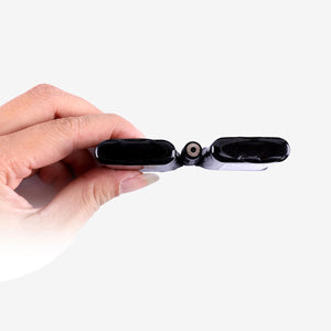 Hand holding a Venture Heat battery pack showing the charging port