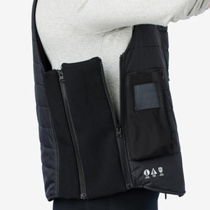 Side view of Venture Heat black quilted vest with expandable ribbed side panel and battery pocket