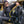 Person wearing Venture Heat vest and beanie sitting next to scuba diving gear