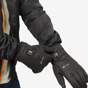 Person wearing black Venture Heat heated gloves with power button visible