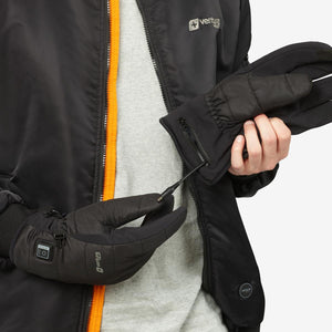 Person connecting power cable to Venture Heat heated glove