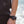Venture Heat controller worn on wrist and attached to black vest