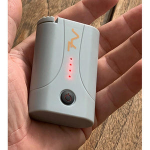 Volt Heat rechargeable battery pack with power indicator lights held in hand