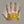 Volt Heat hand measuring guide showing a yellow tape measure wrapped around the palm