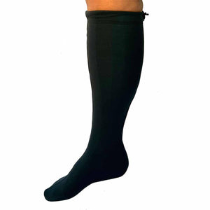 Black knee high compression sock on a lower leg