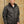 Man wearing a black Volt Heat quilted jacket with a front zipper and chest pocket