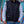 Person wearing a black Volt Heat quilted vest over a white long sleeve shirt