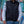 Person wearing a black Volt Heat quilted vest over a long sleeve white shirt