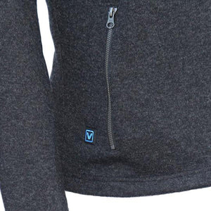 Close up of dark grey fleece jacket with vertical zippered pocket and V logo patch