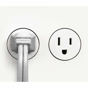 Vornado power plug inserted into a wall outlet