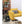 Black Vornado air circulator fan on a patterned rug next to a yellow armchair