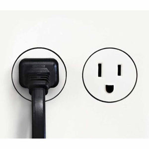 Vornado power cord plugged into a wall outlet next to an empty outlet