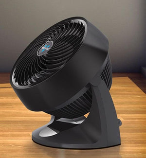 Black Vornado air circulator fan on a wooden surface
