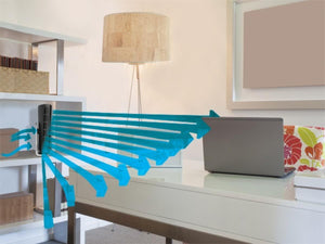 Vornado tower fan on a shelf blowing air toward a laptop on a desk