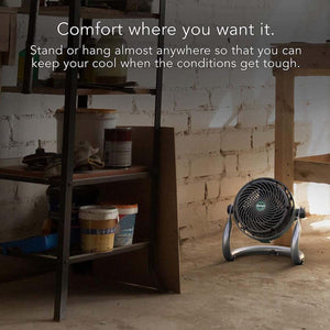 Vornado utility fan sitting on a concrete floor in a workshop
