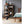 Vornado tower heater on wooden floor in bedroom next to wooden bookshelf