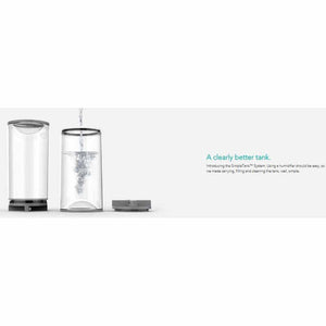 Vornado humidifier SimpleTank system showing water being poured into a clear tank