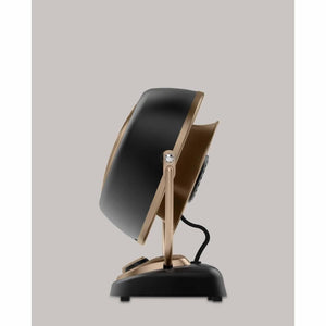 Side view of a black and bronze Vornado air circulator fan on a stand
