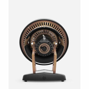Back view of a Vornado space heater with a circular design and adjustable thermostat dial