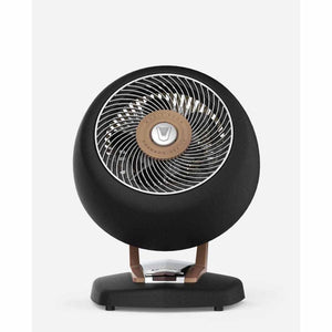 Vornado black spherical space heater with metallic accents on a stand