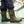 Person wearing brown Muck Chore Cool rubber boots with dark blue work pants