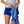 Person placing a grey item into a blue Nathan hydration vest
