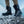 Person wearing black Baffin winter boots on a snowy and rocky surface
