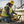 Construction worker using a DeWalt rotary hammer drill on a concrete wall