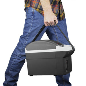 Person carrying a Wagan portable electric cooler by its shoulder strap
