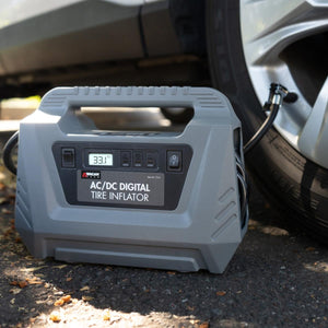 Wagan AC DC digital tire inflator connected to a car tire